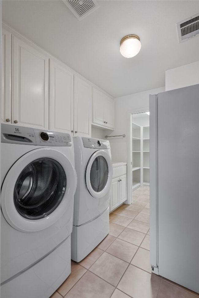 Laundry/utility room with storage cabinets, a sink and shelving for all of your storage needs | Image 38