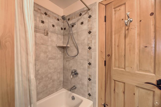 Full bathroom with shower / bath combo with shower curtain | Image 28