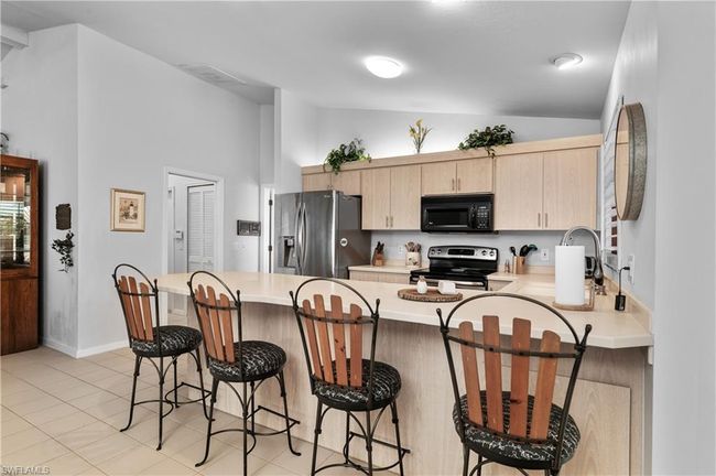 12321 Moon Shell Dr, House other with 3 bedrooms, 3 bathrooms and 2 parking in MATLACHA ISLES FL | Image 11