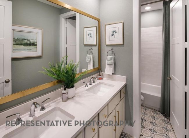 Bathroom with double vanity and shower / tub combination | Image 18