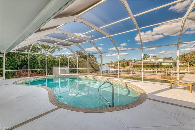 Pool featuring a lanai and a patio | Image 7