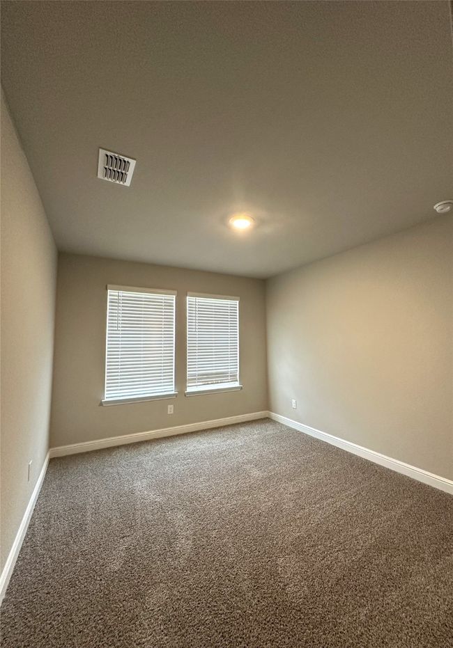 Carpeted empty room featuring baseboards | Image 21