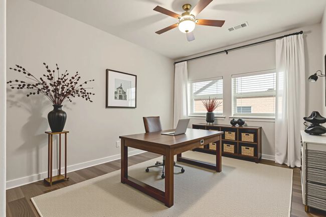 Virtually staged Office space with ceiling fan, dark wood-type flooring, and baseboards | Image 30
