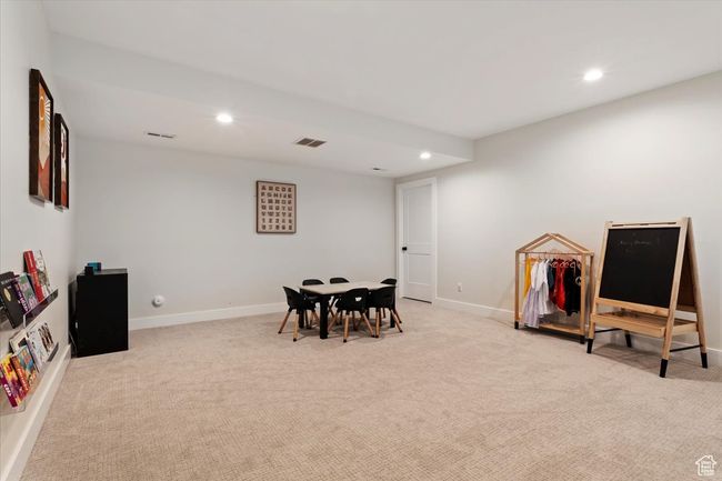 Recreation room featuring baseboards, visible vents, recessed lighting, and carpet flooring | Image 28
