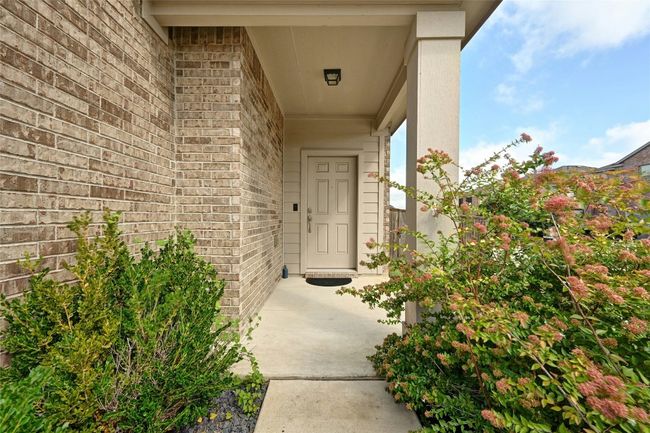 Doorway to property with brick siding | Image 25