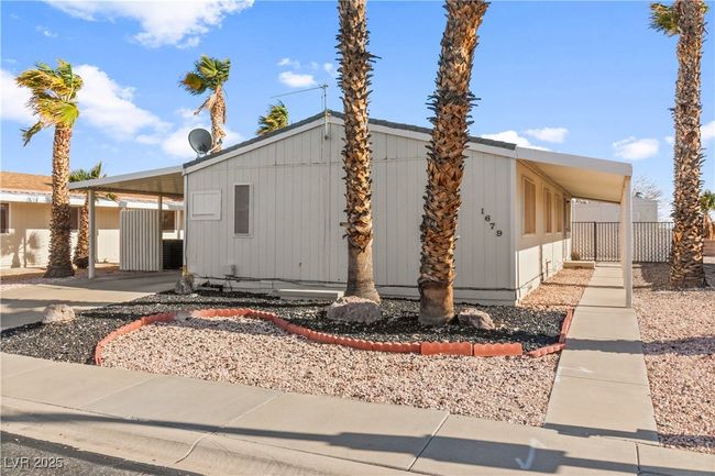 View of front of property featuring a carport and crawl space | Image 27