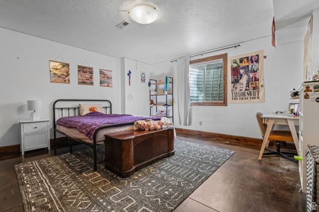 Bedroom with a textured ceiling | Image 45