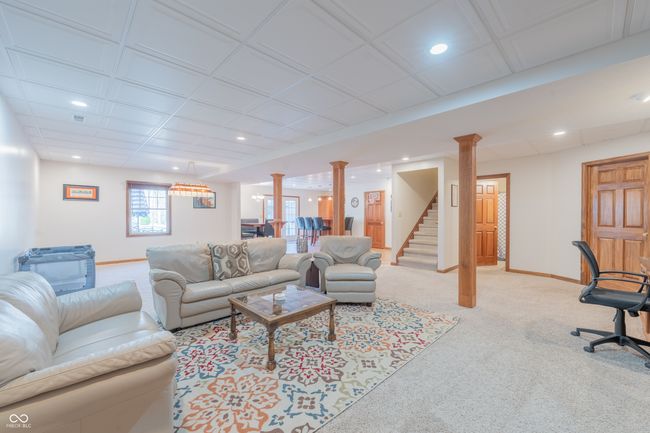 living room featuring light carpet, baseboards, and recessed lighting | Image 19