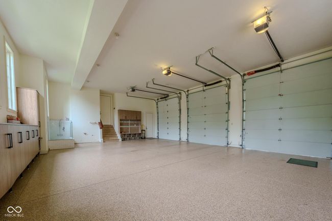 garage featuring a dog wash area | Image 114