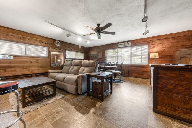 Enclosed garage made into a family/game/bar area | Image 19