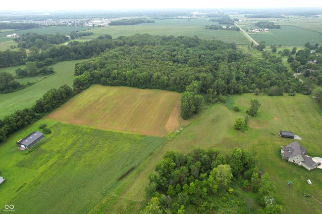 overview of rural landscape featuring rows of crops | Image 4