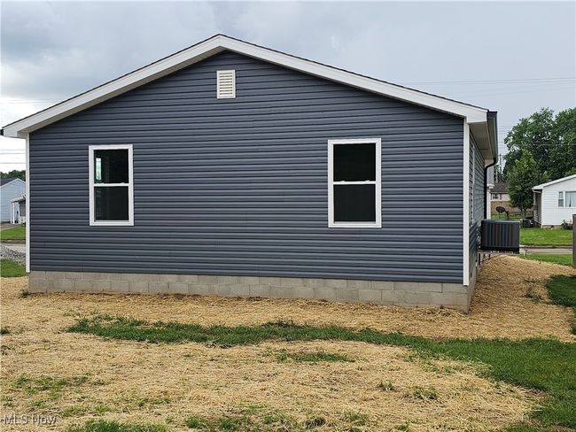 View of side of property with raised central AC | Image 22
