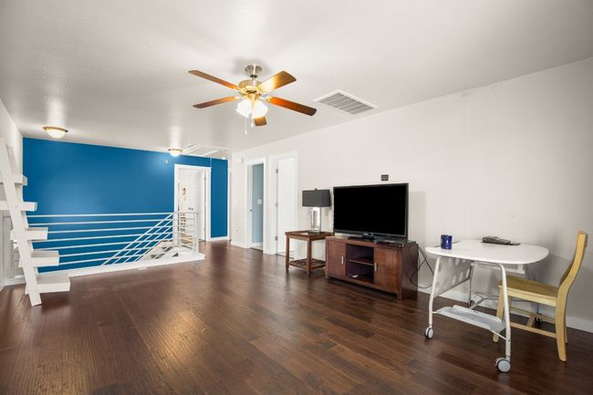 The upstairs game room offers versatile space, perfect for a media room, play area, or home office. | Image 12