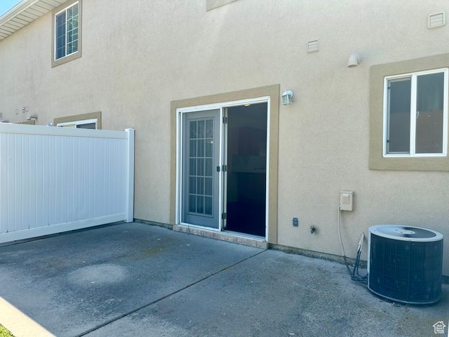 View of private patio open to views of the picturesque water and landscaping | Image 13