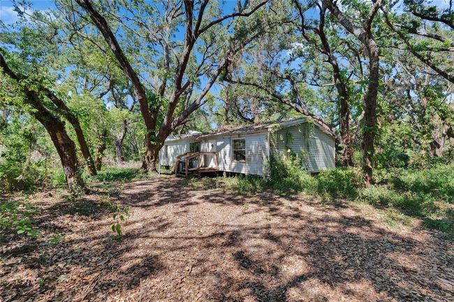 Doublewide that needs a lot of work, but could become a second home on the property | Image 63