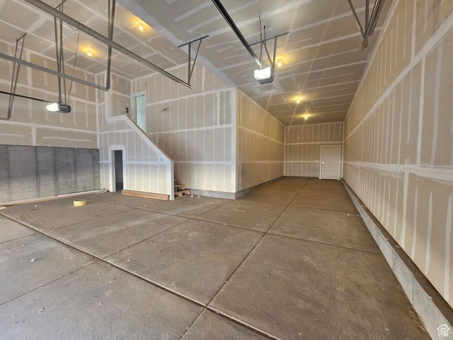 Garage with a garage door opener | Image 29