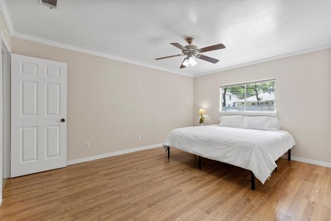 With its generous size and calming neutral tones, the primary bedroom provides the perfect space for rest and rejuvenation at the end of the day | Image 12