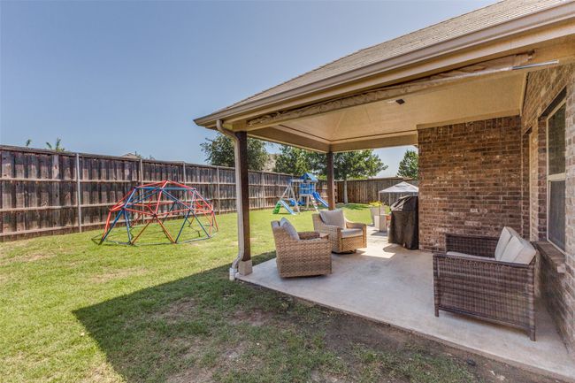 View of backyard from the side of the home. | Image 25