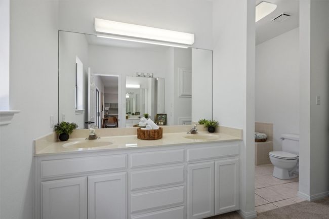 Full bath with double vanity, visible vents, tile patterned flooring, and a sink | Image 19