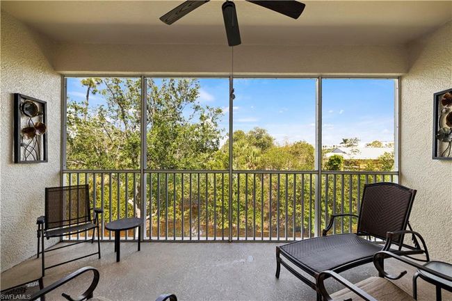 Sunroom /screened lanai with a wealth of natural light | Image 24