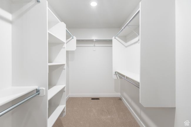 Walk in closet featuring carpet floors | Image 15
