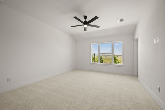 This dreamy owner's bedroom offers plenty of space and natural light. | Image 12
