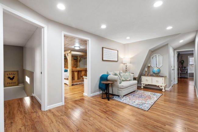 Wide hallway with cozy reading area | Image 21