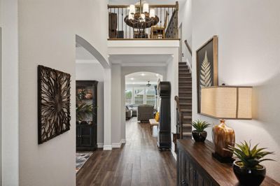 Foyer with a view straight through to back yard. Dramatic high ceiling | Image 2