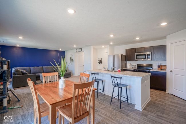 dining room with light wood finished floors and recessed lighting | Image 16