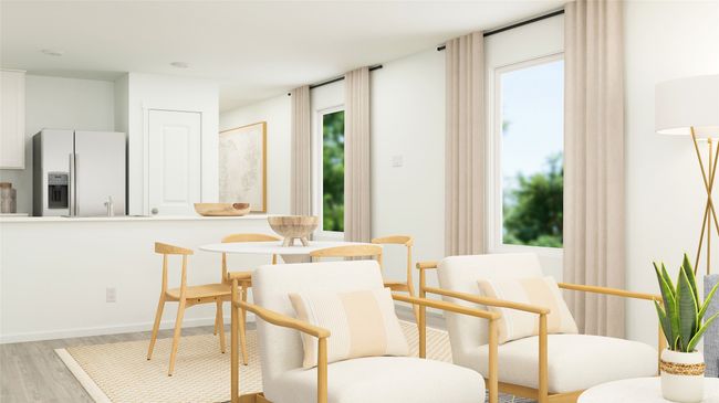 Dining area featuring light wood-style flooring and baseboards | Image 10