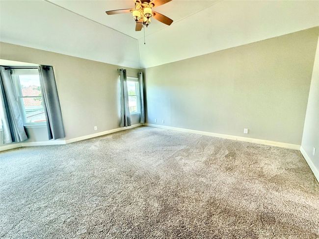 Empty room featuring ceiling fan and carpet flooring | Image 14
