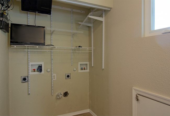 Clothes washing area featuring electric dryer hookup, gas dryer hookup, laundry area, and washer hookup | Image 21