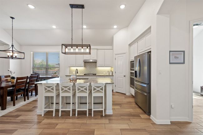 Bright, open kitchen with a generous island for cooking, serving, and connecting with guests. | Image 8