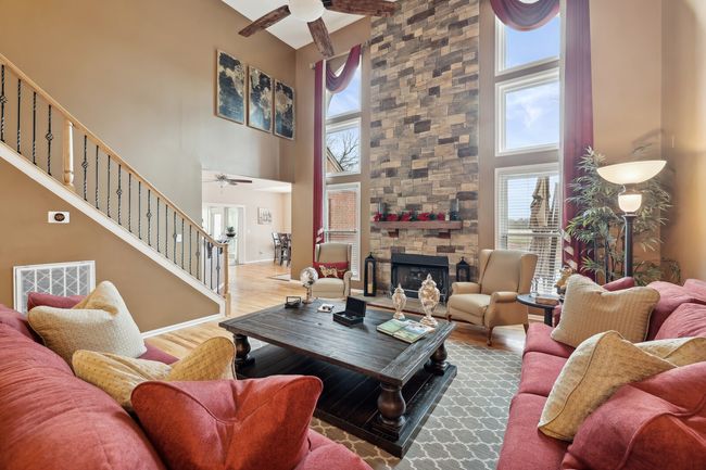 Stairs feature newer hardwood treads and new metal railing. | Image 8
