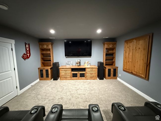 Home theater room with recessed lighting and carpet floors | Image 46
