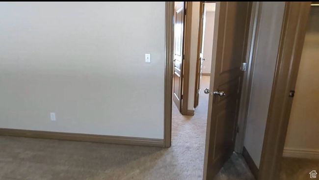Hallway with baseboards and carpet | Image 28