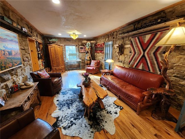 Living room with wood finished floors and recessed lighting | Image 20