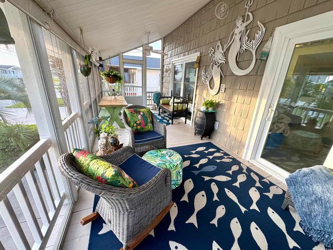 Sunroom / solarium with vaulted ceiling, healthy amount of natural light, and a ceiling fan | Image 16