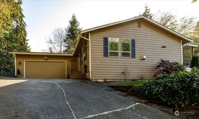 Extra graveled space to the left for extra parking beside house. | Image 3