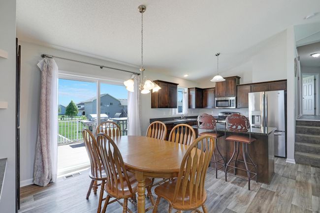The spacious dining area easily accomodates a large table, making it ideal for family gatherings and entertaining guests. | Image 11