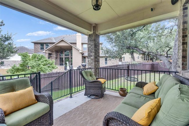 Deck with an outdoor hangout area. | Image 4