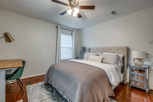 Bedroom with wood finished floors and a ceiling fan | Image 25