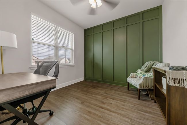 Home office featuring ceiling fan and light wood-style flooring | Image 9