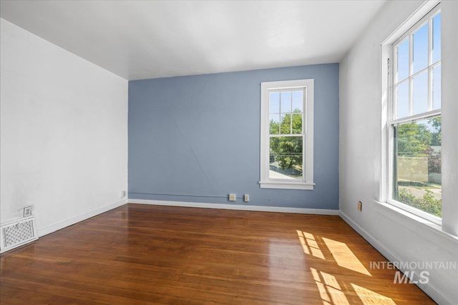 Unfurnished room featuring wood finished floors and baseboards | Image 38