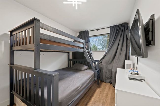 Bedroom with wood finished floors | Image 10