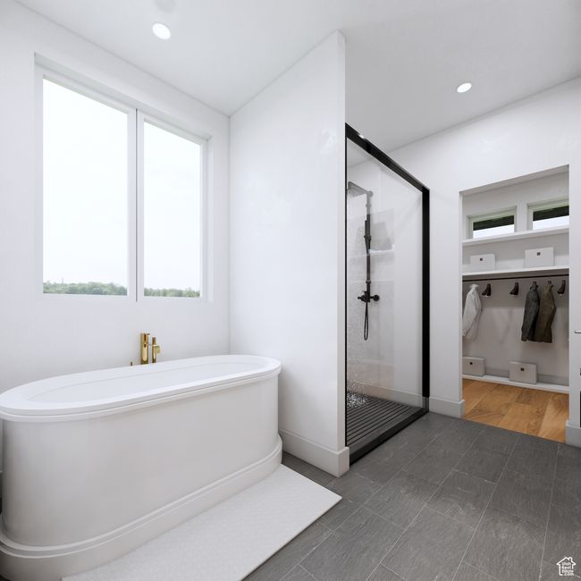 Bathroom featuring baseboards, a freestanding tub, recessed lighting, and a stall shower | Image 7