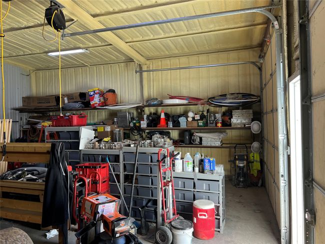 Garage featuring metal wall | Image 35