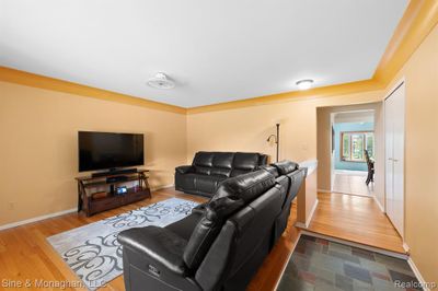 Slate entry foyer opens to living room | Image 3