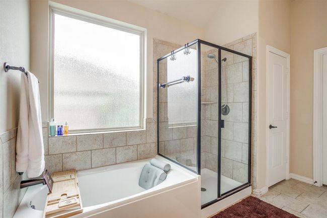 Soaker tub with bright window. | Image 15