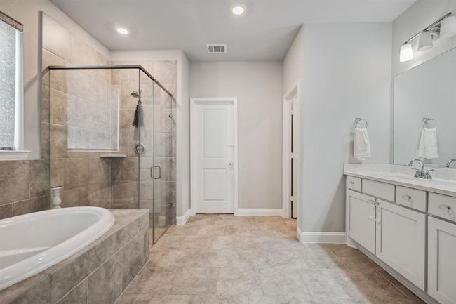 Primary bedroom ensuite with large soaking tub, separate shower and double sinks | Image 21